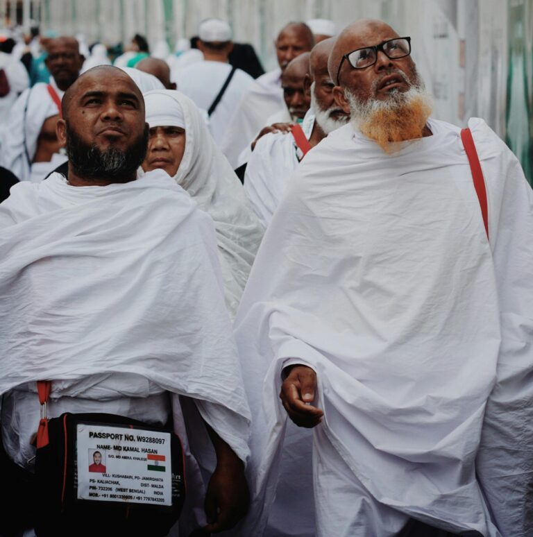 Group of Muslim pilgrims in traditional attire during Hajj in Mecca, Saudi Arabia.